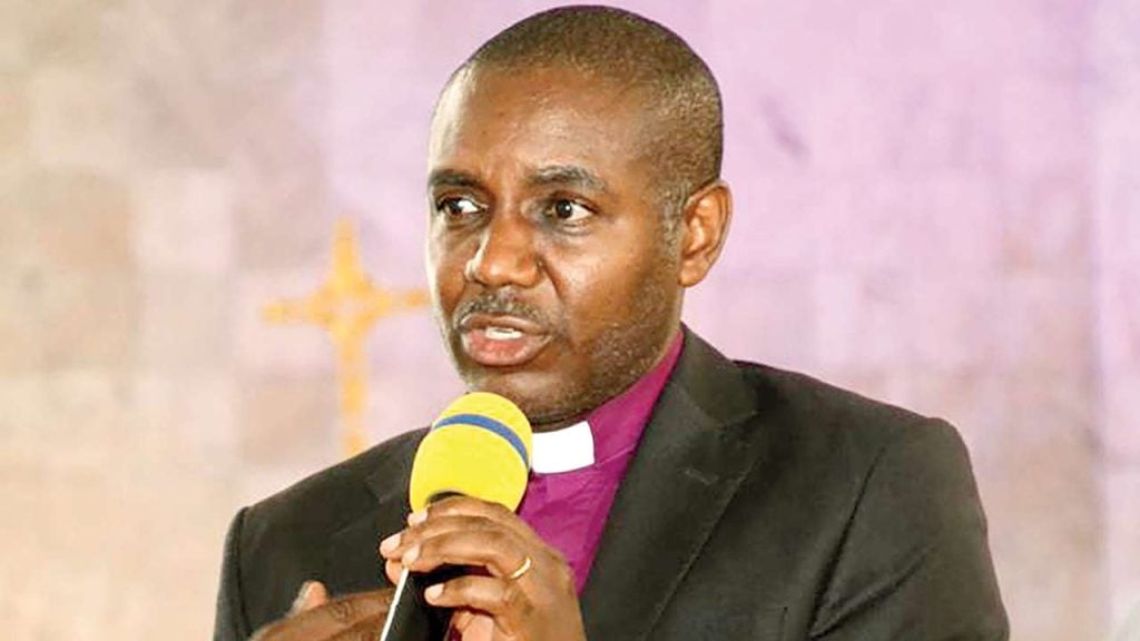 Anglican Bishop under attack for kneeling before Enugu PDP guber candidate, Mbah [VIDEO]